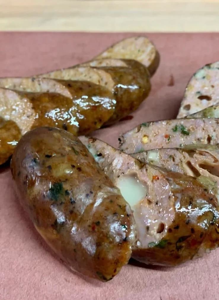 Homemade smoked BBQ sausage with hatch green chile and fontina